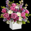 A playful spin on the classic rose arrangement, these lovely lavender blooms