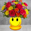 Happiness, delivered! Colorful roses in a cheerful ceramic planter are the quickest