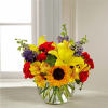 Beautiful and vibrant colors of alstroemeria, larkspur, spray roses, carnations, sunflowers, and