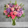 Soft pink roses breathe life into this perfectly feminine arrangement. This charming
