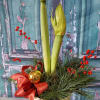 A beautiful gift for the holidays.  Adorned with festive evergreens, red