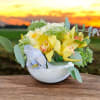 Brighten any space with our Sunny Orchid Bliss Arrangement, a vibrant blend