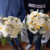 Beautiful white garden and standard roses, dahlia, freesia and yellow tulips and