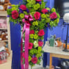 Large arrangement in the shape of cross. Includes hot pink roses, hot