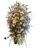 This elegant funeral arrangement combines the timeless beauty of roses, the purity