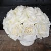 Pure and elegant, this arrangement features an abundance of premium white roses
