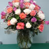 Beautiful Arrangement filled with sixty-two multi-colored Roses or similar flowers filled with