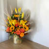 Autumn glimmer is a quintessential fall arrangement featuring a gold architecture vase