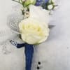 This pin on mens blue and white boutionnere using seasonal garden flowers