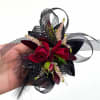 Our premium red and black wrist corsage used dark spray roses and