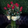 Romanza Italia is made with a dozen roses, hydrangea, seasonal greenery, and