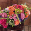 
This stunning, long and low vase arrangement of seasonal dahlias is here