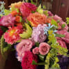 
This stunning, long and low vase arrangement of seasonal dahlias is here