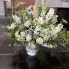 A loving tribute for a memorial service or funeral. Colors and flowers