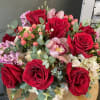 A dreamy mix of a dozen red roses, pink hydrangea, eucalyptus, orchids