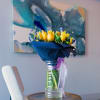 This bouquet is a celebration of contrasts and harmony! Vibrant yellow roses