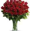 Sweep her off her feet with two dozen red roses in a
