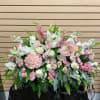 Half Size Casket Spray with light pink spray roses, hydrangea, lisianthus, snapdragons