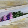 The ecstasy and charm of lavender roses fill the air with elation.