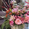 This magnificent floral arrangement is designed to bring joy and warmth to