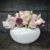 Soft, delicate, and utterly timeless, this Blush Elegance arrangement features pale pink