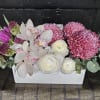 A stunning combination of elegance and vibrancy, this arrangement features a harmonious