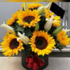 caja cilindrica elaborado con girasoles segun su tama&ntilde;o la cantidad y lilis