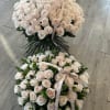 A light roses basket is a graceful arrangement featuring soft-toned roses in