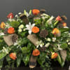 Masculine casket spray complete with gorgeous high magic roses, white lilies, a