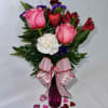 Roses-alstromeria-carnations in a cute vase with a Valentine&#039;s Day bow.