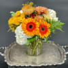 &quot;Morning Sunrise&quot; features a vibrant mix of fiery orange Gerbera Daisies, Golden