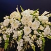 This all white  casket spray will express the love you have