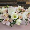 Elevate any setting with this exquisite arrangement featuring a harmonious blend of