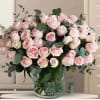 Delicate and breathtaking, this elegant arrangement features 50 pink roses, beautifully accented