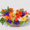 This arrangement will catch eyes with its mix of vibrant oranges and