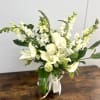 Pretty design including rose, lily, snapdragon and accents in a glass vase.