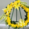 Standing wreath including white and yellow flowers.
STANDARD: As Shown
DELUXE: Will include two