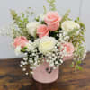 Mixture of roses, greens and baby&#039;s breath. ***Vase can be substituted and