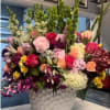 An amazing color combination of natural wild flowers, lilies, roses, bells of