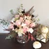 An exquisite flower bouquet, that illustrate a pink and burgundy shades, with