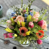 This flower arrangement is a vibrant and elegant display of color and