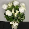 A gorgeous display of white roses with white spray roses, arranged in