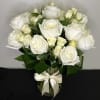 A gorgeous display of white roses with white spray roses, arranged in
