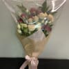 A bouquet of red, white and pink spray roses arranged in a