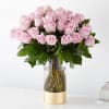 

The picture perfect petals of  36 Roses pink roses gracefully unfold