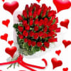 A bouquet of red roses and lush greenery confidently surrounded with cellophane