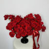 The modern style arrangement in the black vase is an exquisite display