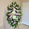This elegant standing spray is a heartfelt way to express your condolences.
