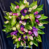 Green + Arc Anthuriums, lavender dendrobium  orchids + roses. Picture is