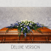 This soft pastel blue and white casket spray is gorgeous and perfect
